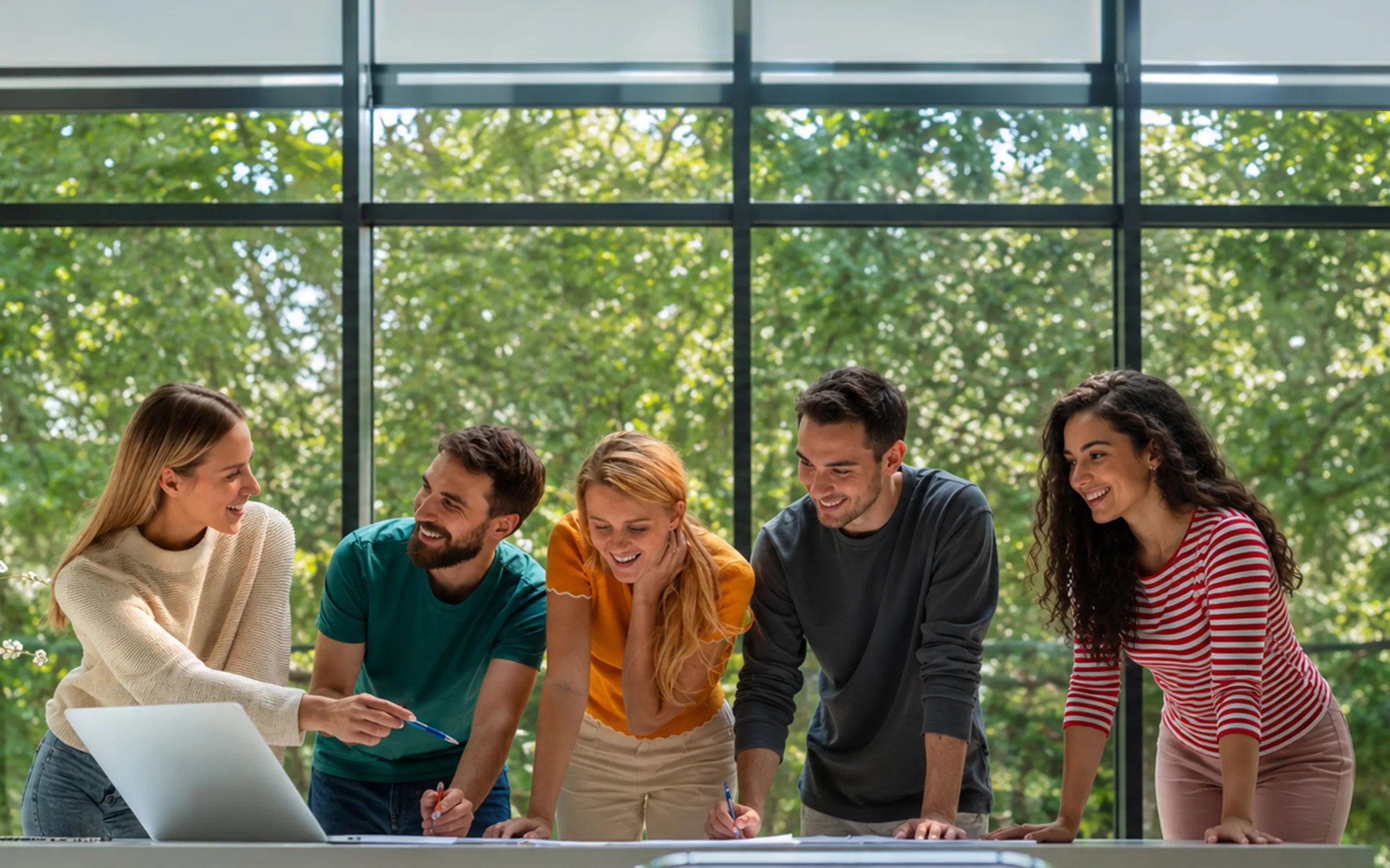 The VORA team working together around a laptop